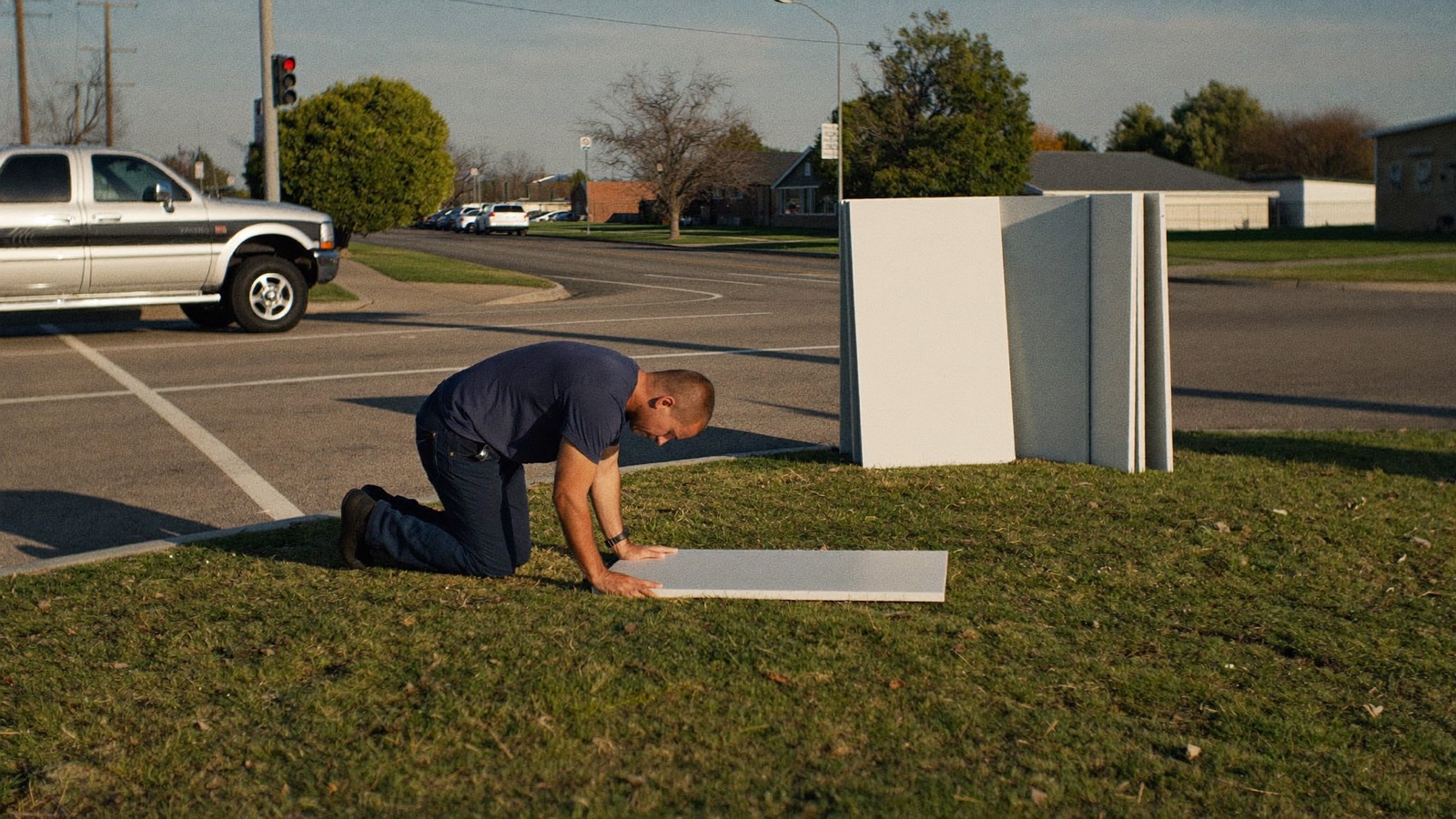 Marketing source report on a laptop showing yard sign calls and revenue