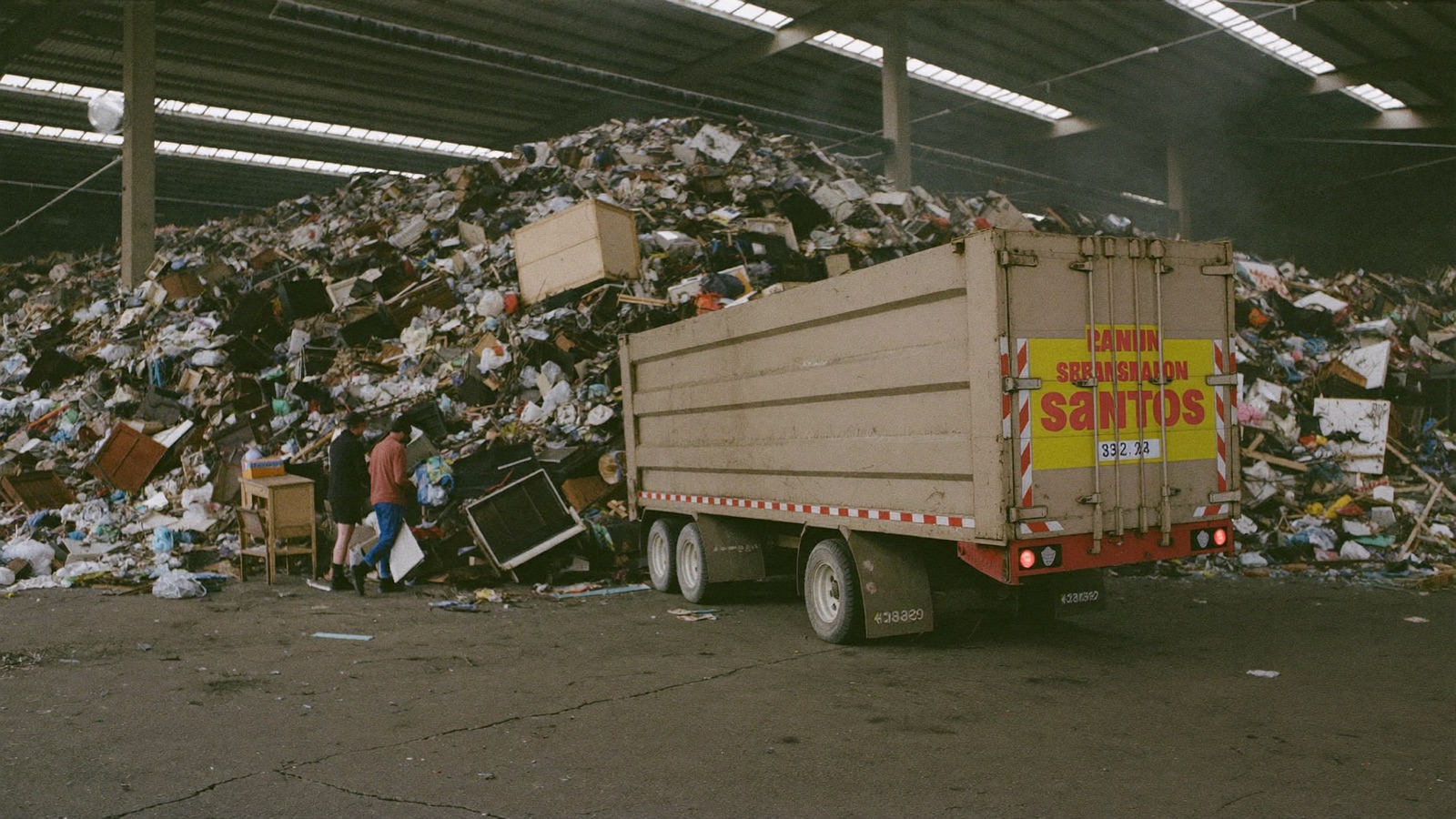 Spreadsheet of junk removal operating costs next to a truck repair invoice